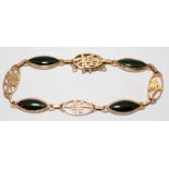 14ct gold and jade bracelet in an Oriental style. O/all length including clasp 19cms. Gross weight