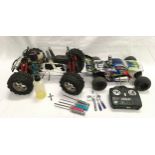 2 x remote control petrol buggies with one controller and tools.