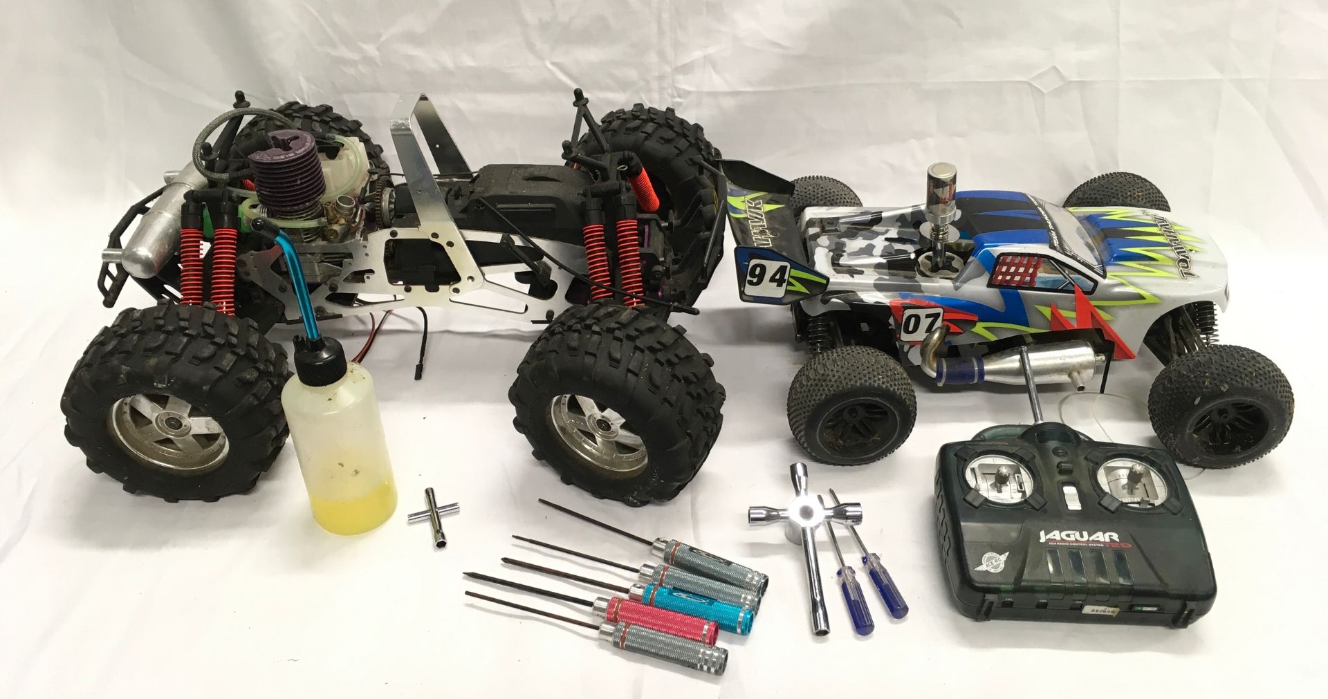 2 x remote control petrol buggies with one controller and tools.