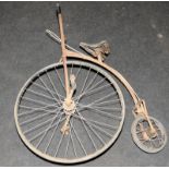 Antique child's Penny Farthing with solid wheels. Seat height 80cms