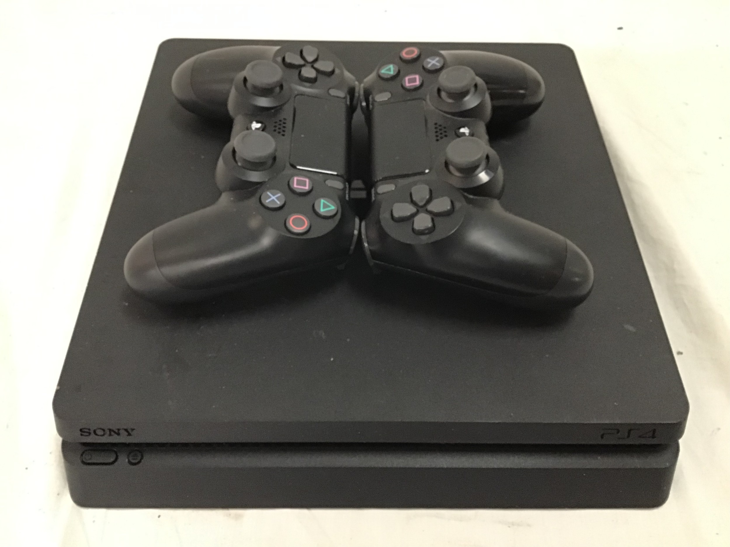 Sony PlayStation 4 with 2 controllers.