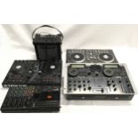 A collection of various DJ mixing units together with a Tascam Studio recorder and Cube guitar