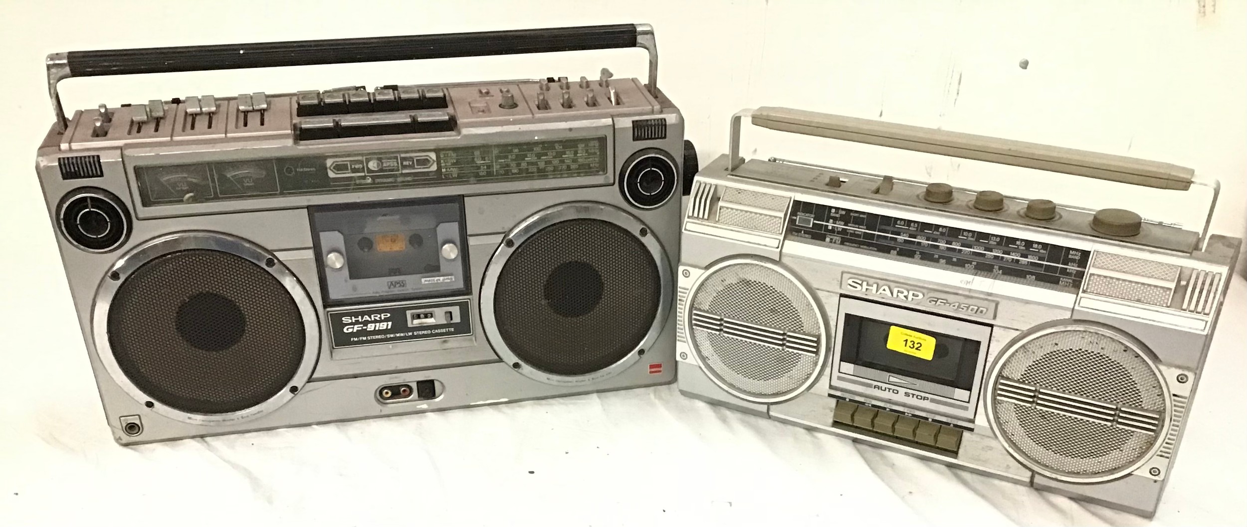 Two Sharp vintage cassette boom boxes.