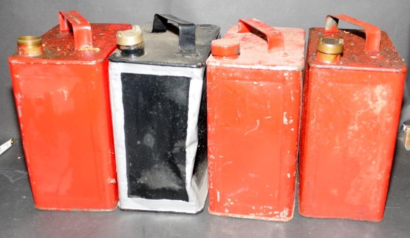 Collection of four vintage petrol cans, three with lids.