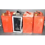 Collection of four vintage petrol cans, three with lids.