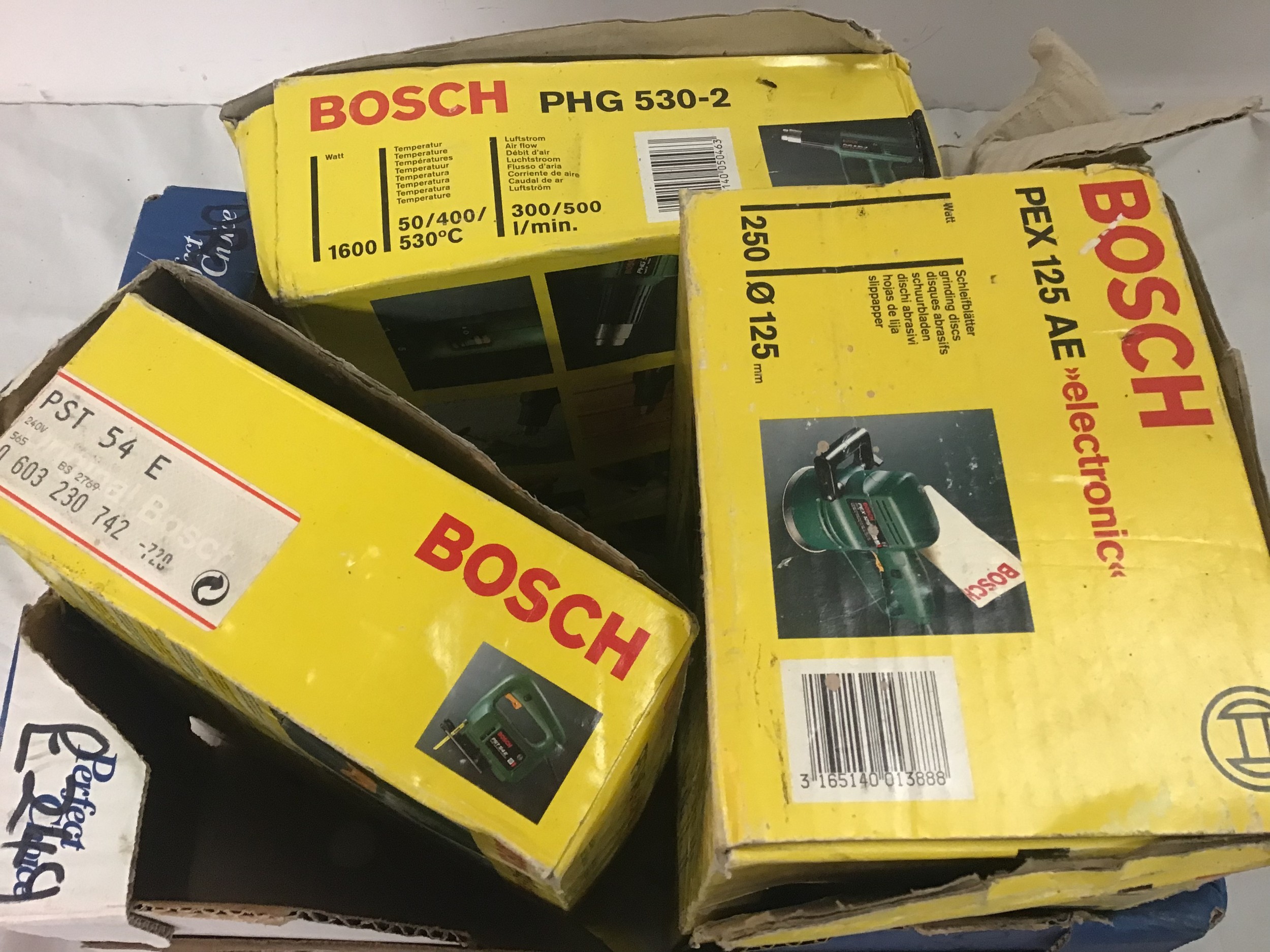 Bosch group of boxed tools to include jigsaw, multi sander and hot air gun.