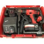 Milwaukee 18v drill with batteries and charger in case.