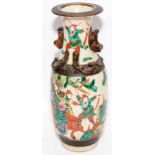 Nanjing earthenware vase depicting warriors and featuring additional relief decoration. 25cms tall
