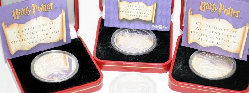 Collection of four Pobjoy Mint 1oz Silver crowns featuring Harry Potter, all different designs to