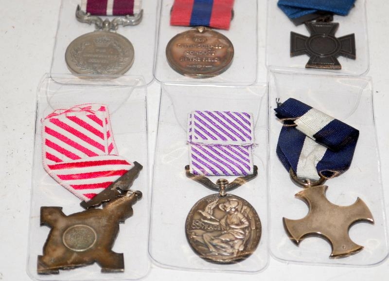 Collection of British military quality copy medals. Includes Air Force Cross, Royal Naval Victoria - Image 2 of 8