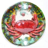 Large Majolica plate featuring a crab. In good condition with no obvious losses or repairs. 30cms