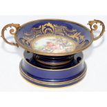 Continental C19 Porcelain and Ormolu mounted comport, painted with a figural scene gilded high