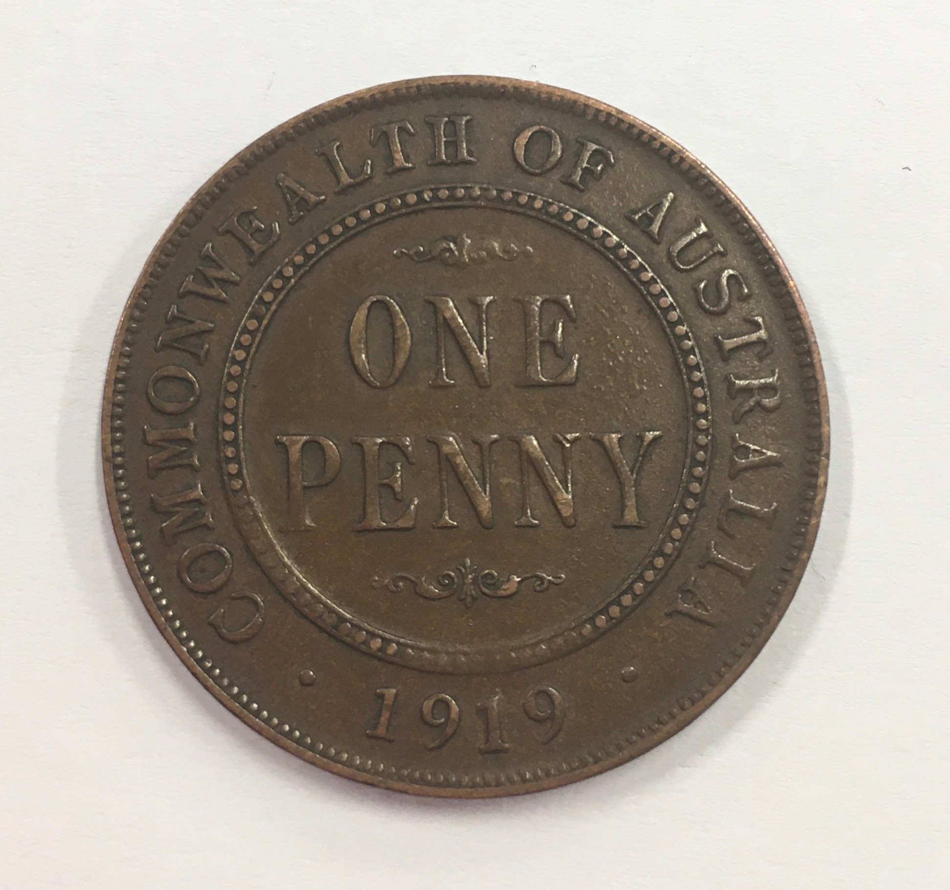 Australia 1919 penny dot below bottom scroll variety.