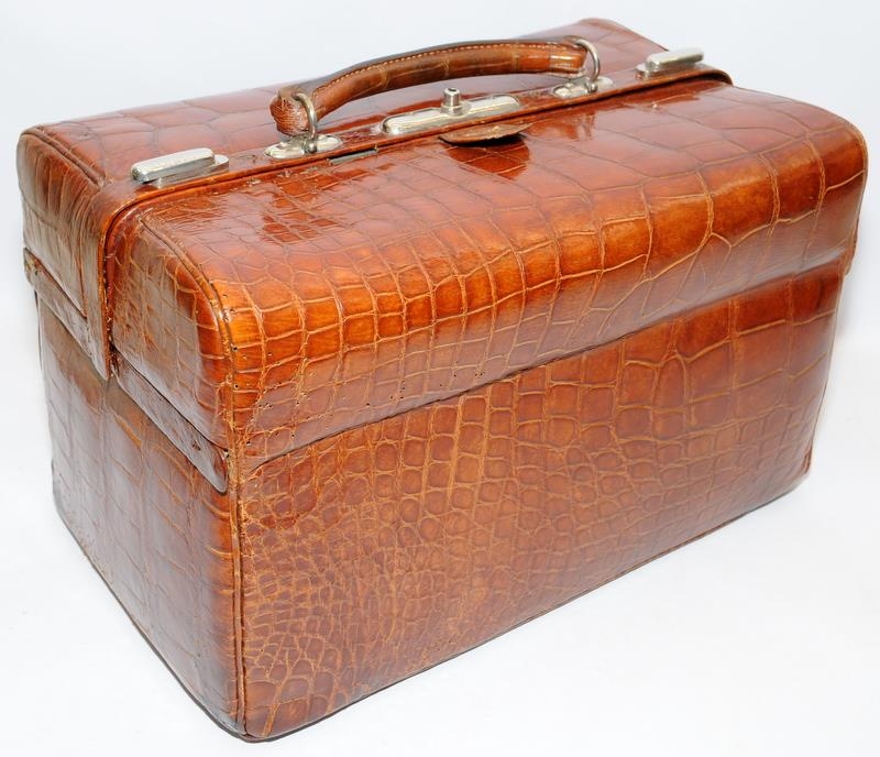 A Moynat of Paris "Croco de Voyage" 1910 a gentlemans travelling fitted vanity case in brown