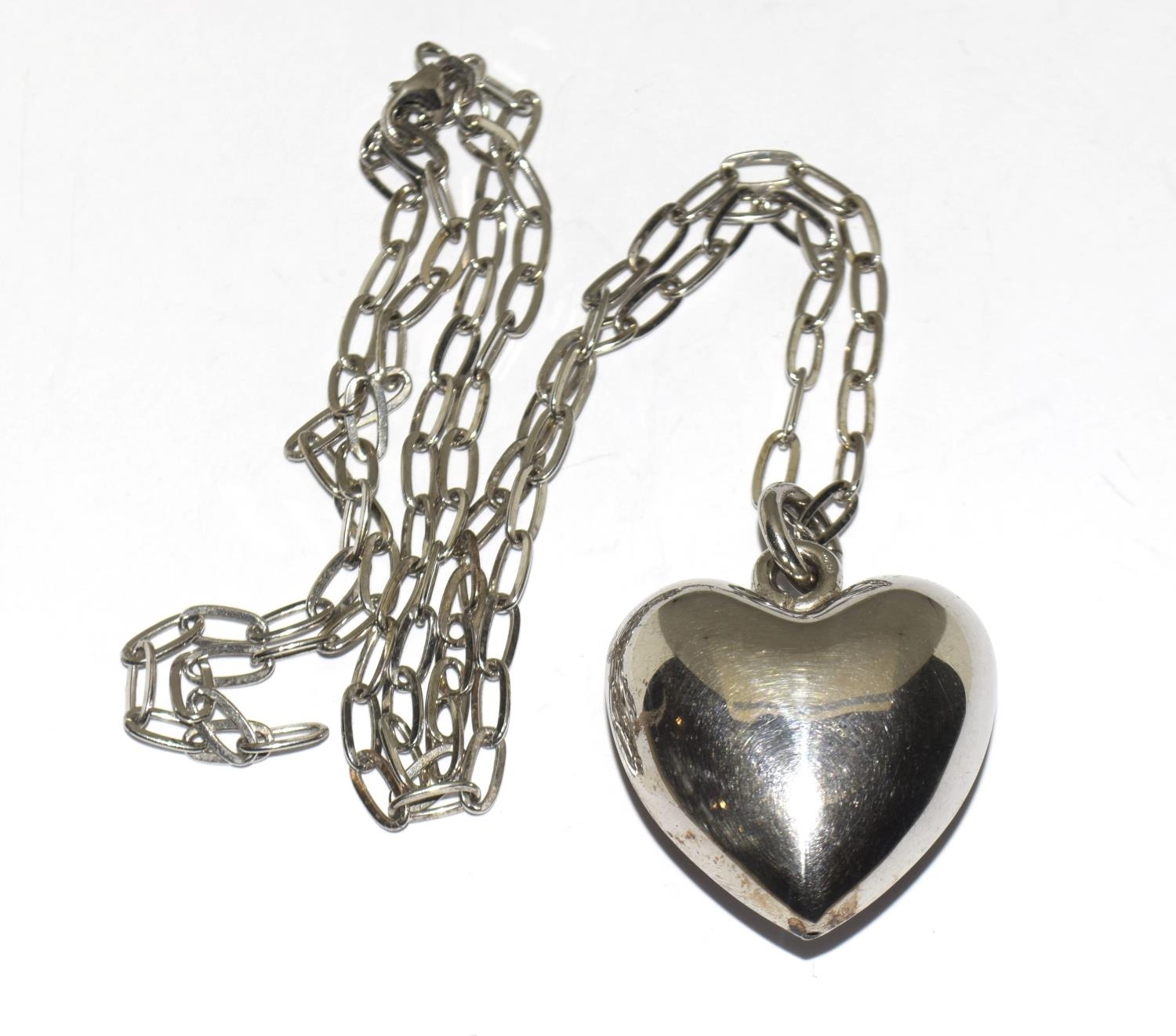 Large 925 silver puffy heart pendant on long chain.