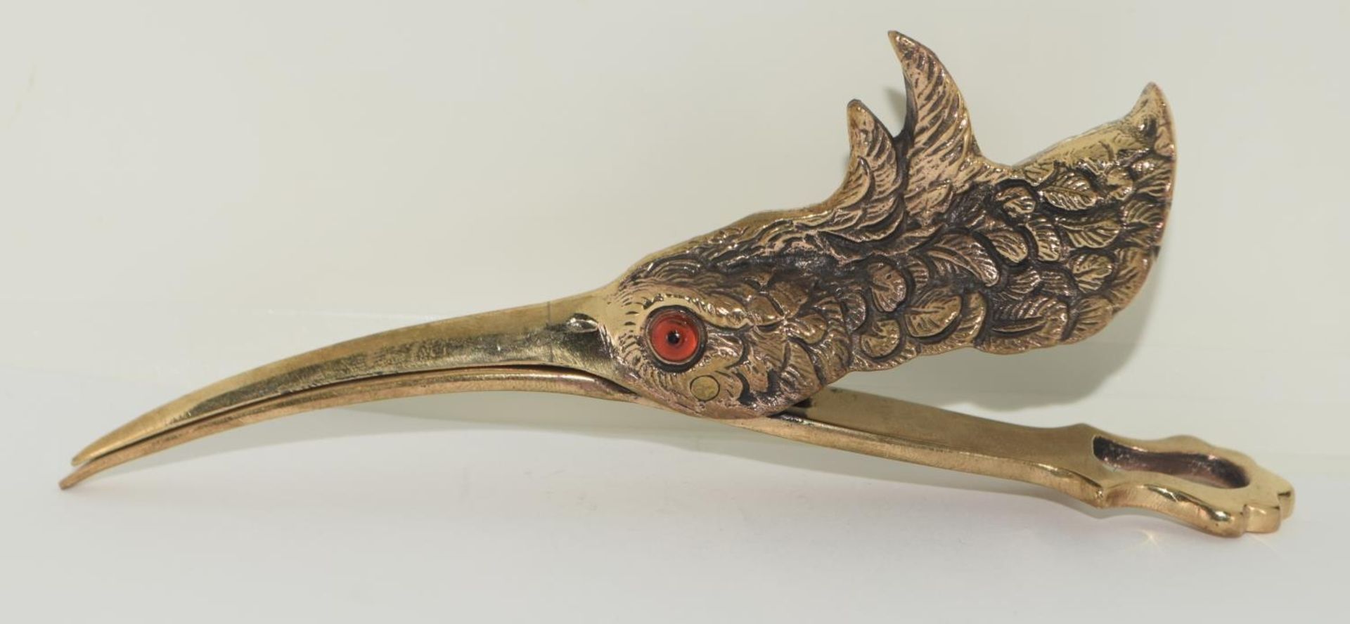 An unusual brass document holder in the form of a waterbird.