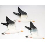 Set of three graduated Beswick seagull wall plaques, the largest being 25cms across