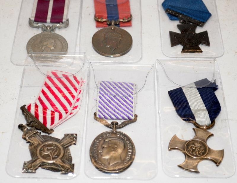 Collection of British military quality copy medals. Includes Air Force Cross, Royal Naval Victoria
