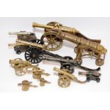 Twelve Table top brass canons longest 31cm