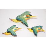 Three Beswick kingfisher wall plaques, one large and two small, the largest being 20cms across
