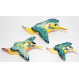 Set of three graduated Beswick kingfisher wall plaques, the largest being 20cms across