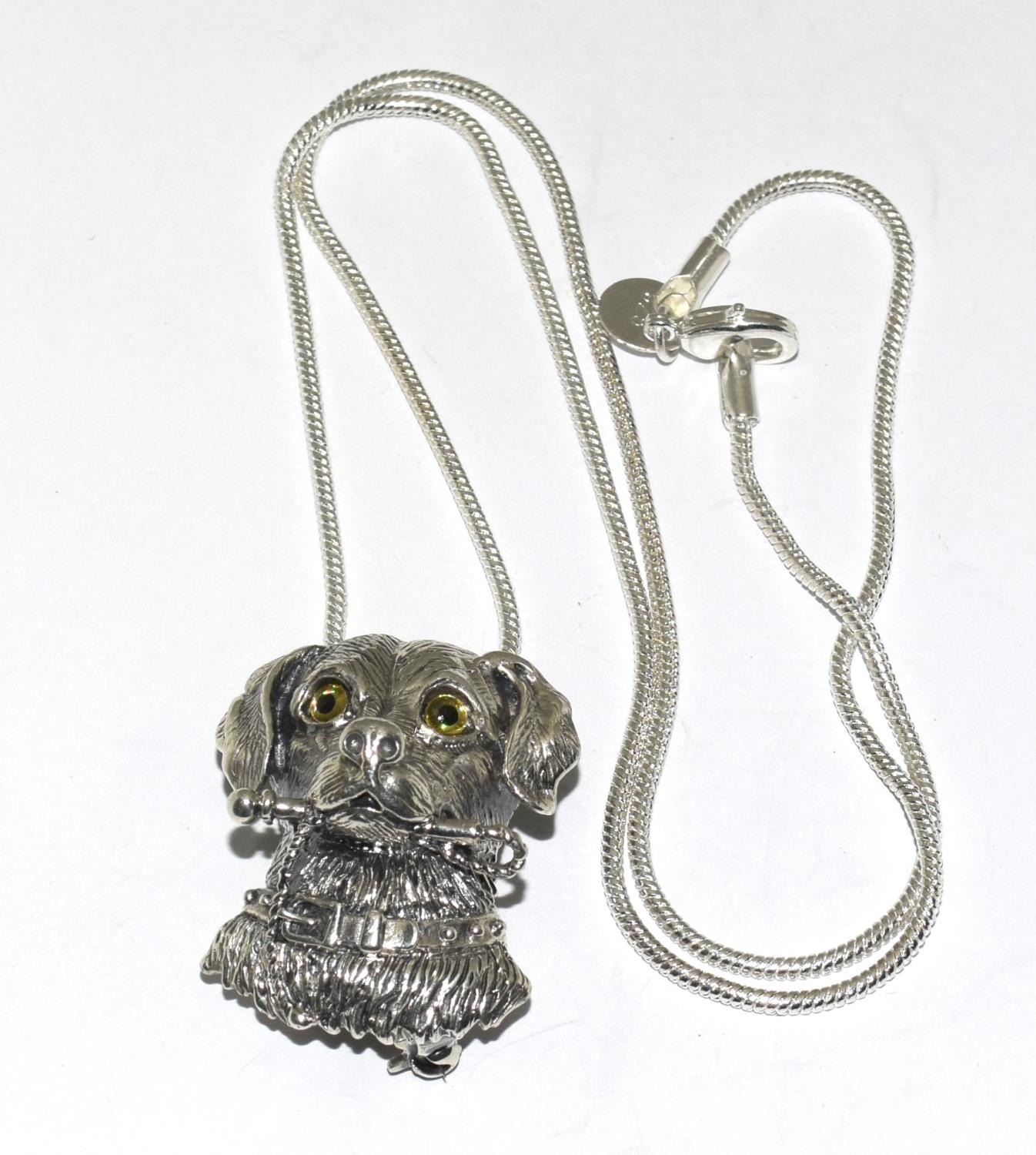 Silver dogs head necklace / brooch with glass eyes.