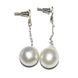 A pair of white gold substantial pear drop earrings.