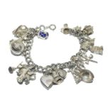 Silver charm bracelet and charms approx (20) 64g