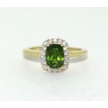 Silver gilt green stone Diamond halo ring. Size P.