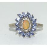 A 925 silver ring with tanzanite and opal stones Size T