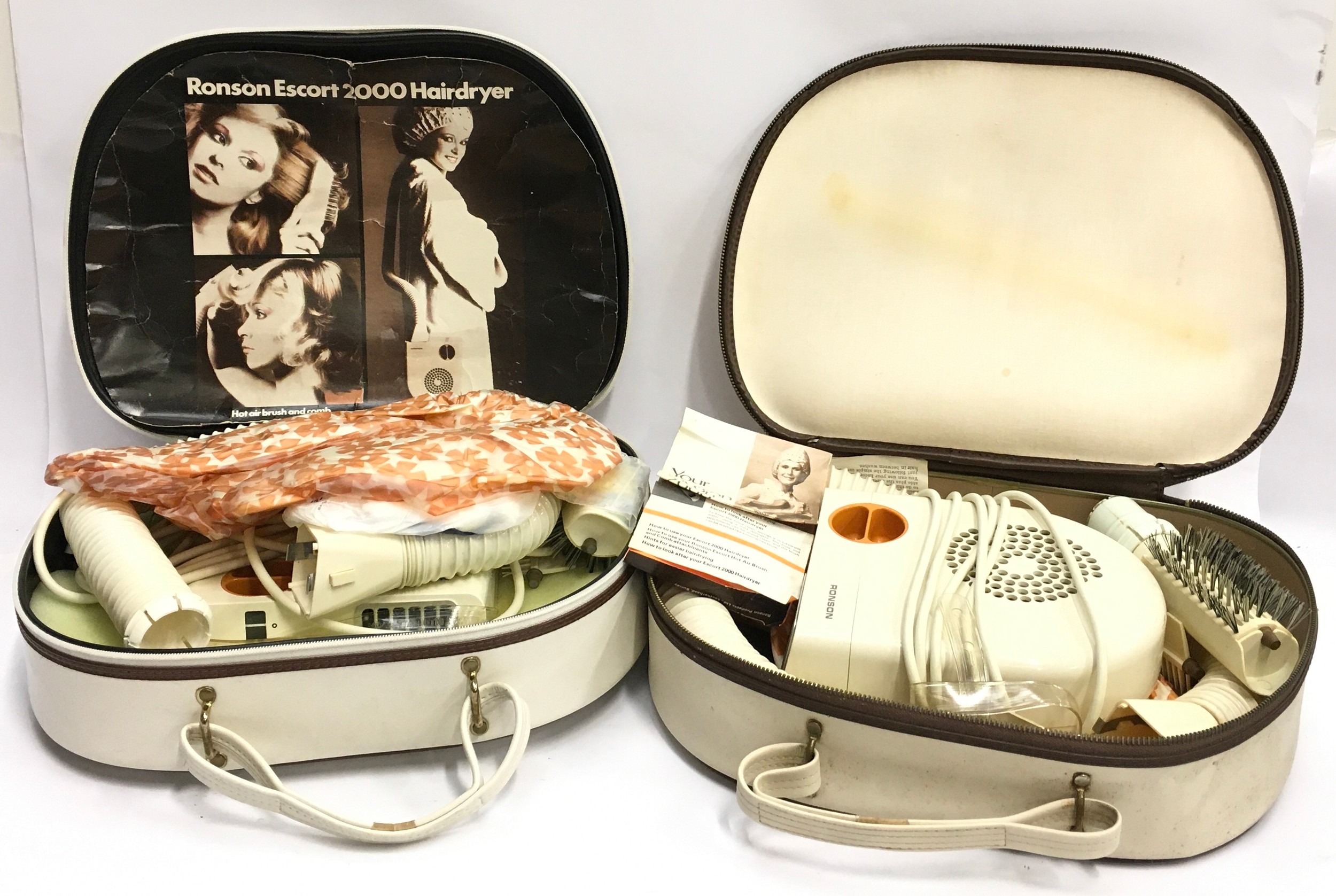 Two vintage 1970's Ronson Escort 2000 hairdryers both cased one with outer box (2).