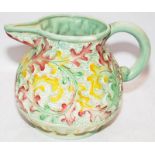 Large Beswick green ground jug with moulded leaf decoration. 22.5cms tall