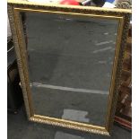 Large contemporary gold gilt over mantle mirror with bevelled edged glass 71x102cm.