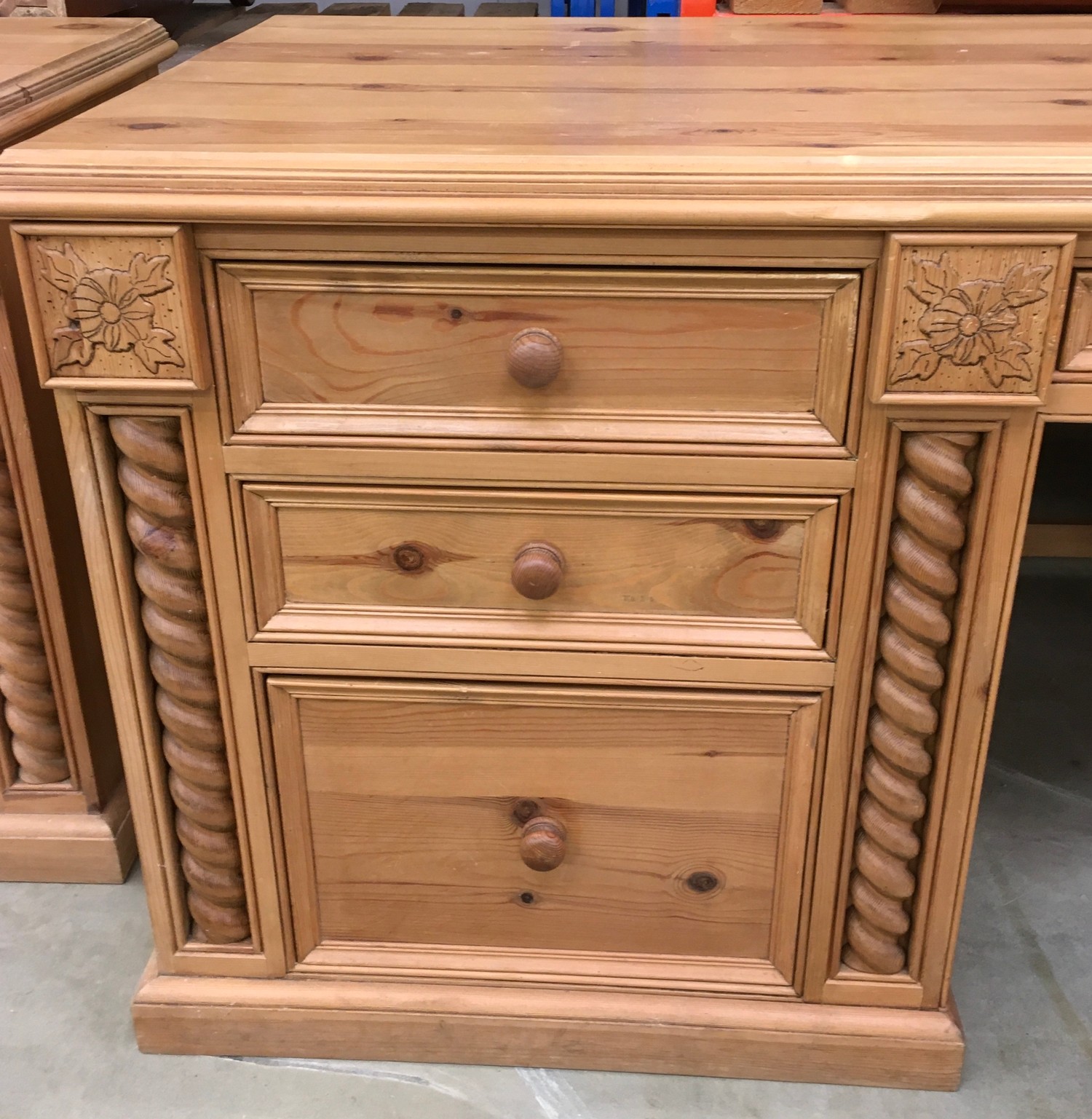 Solid pine desk with 3 side draws and a central draw turned up supports and carved motif - Image 2 of 8