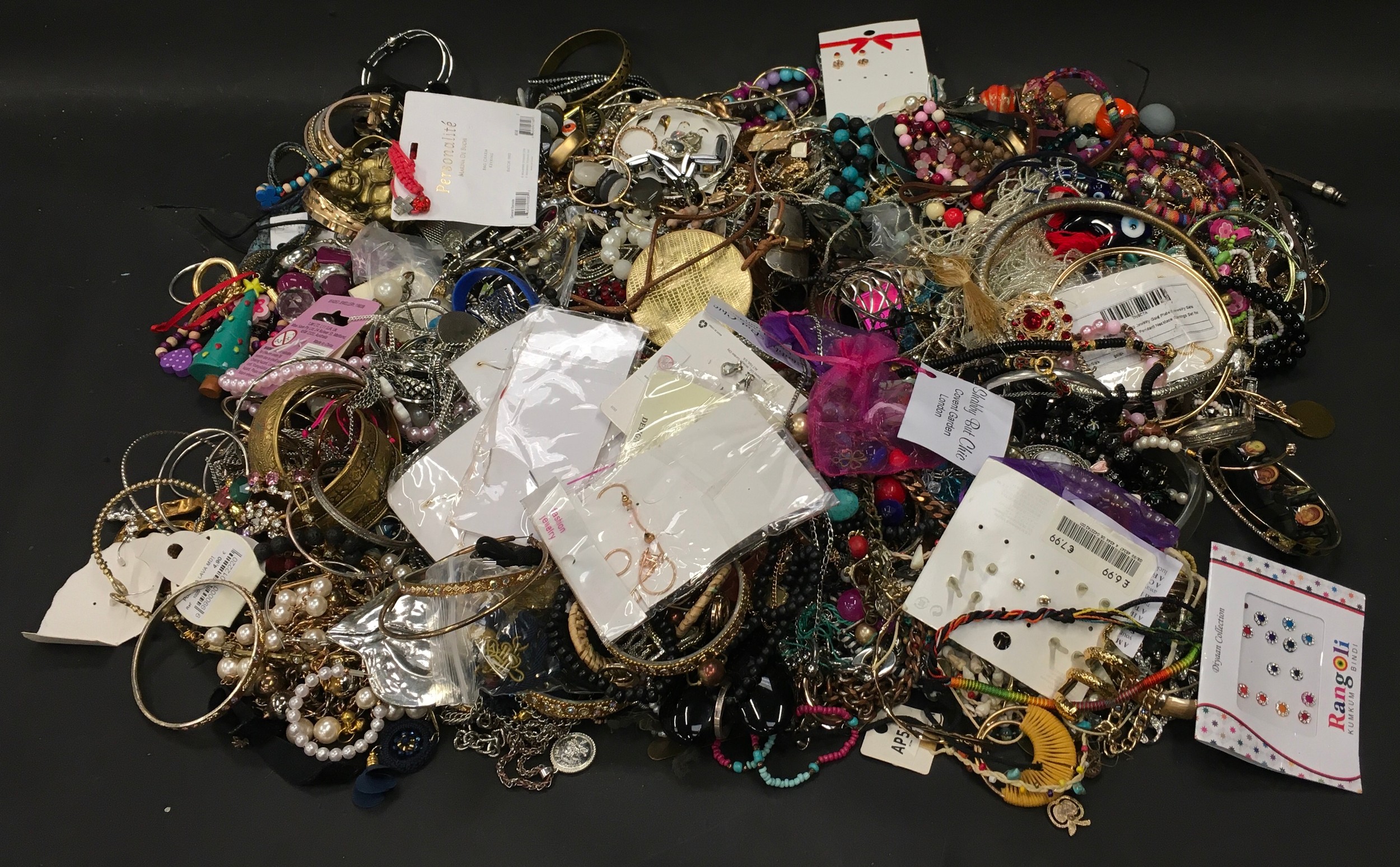 Plastic tub containing a large collection of costume jewellery.