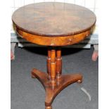 Victorian walnut veneer circular wine table with four drawers under on triple pillar supports over a