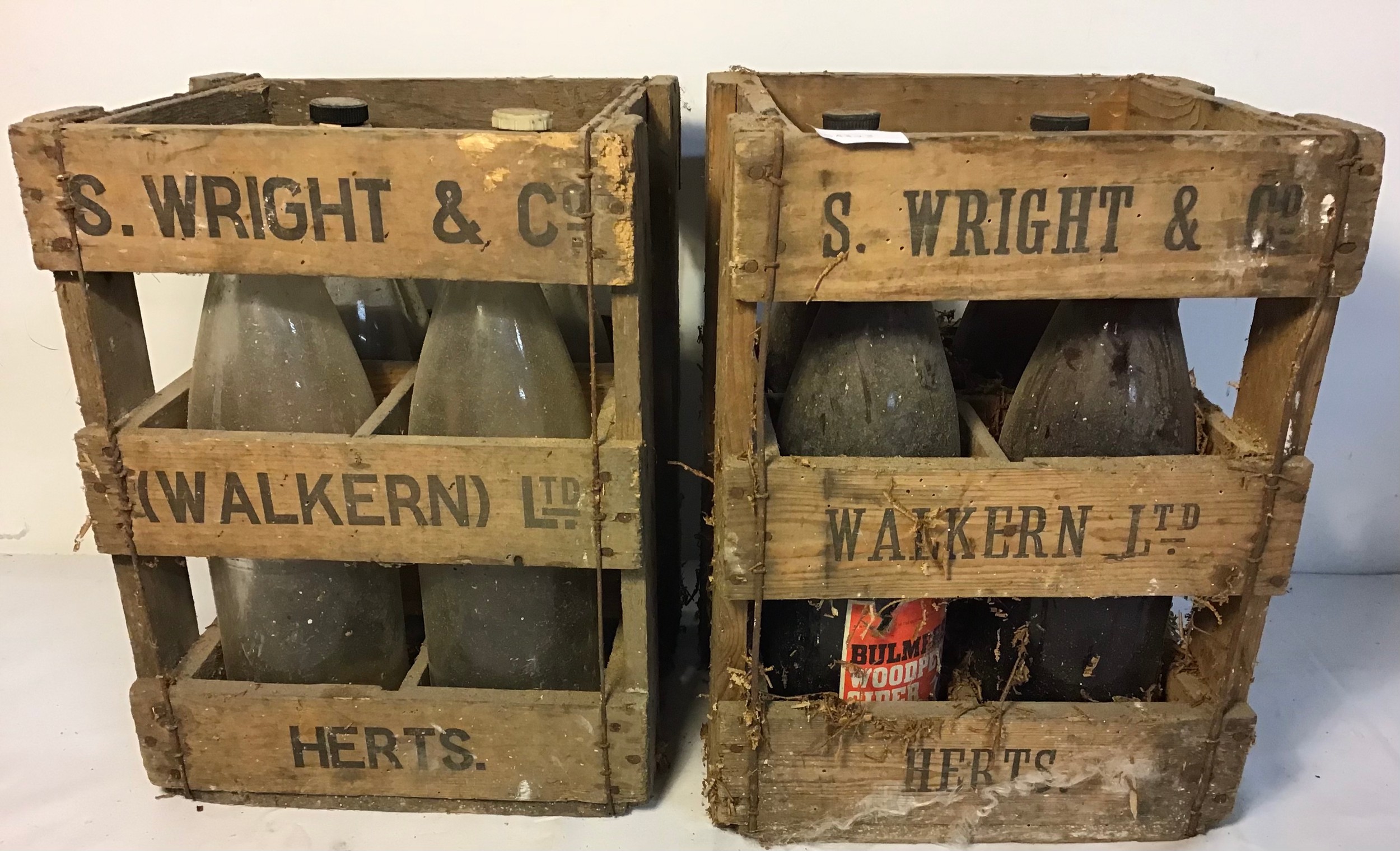 Collection of two advertising crates for glass bottles.