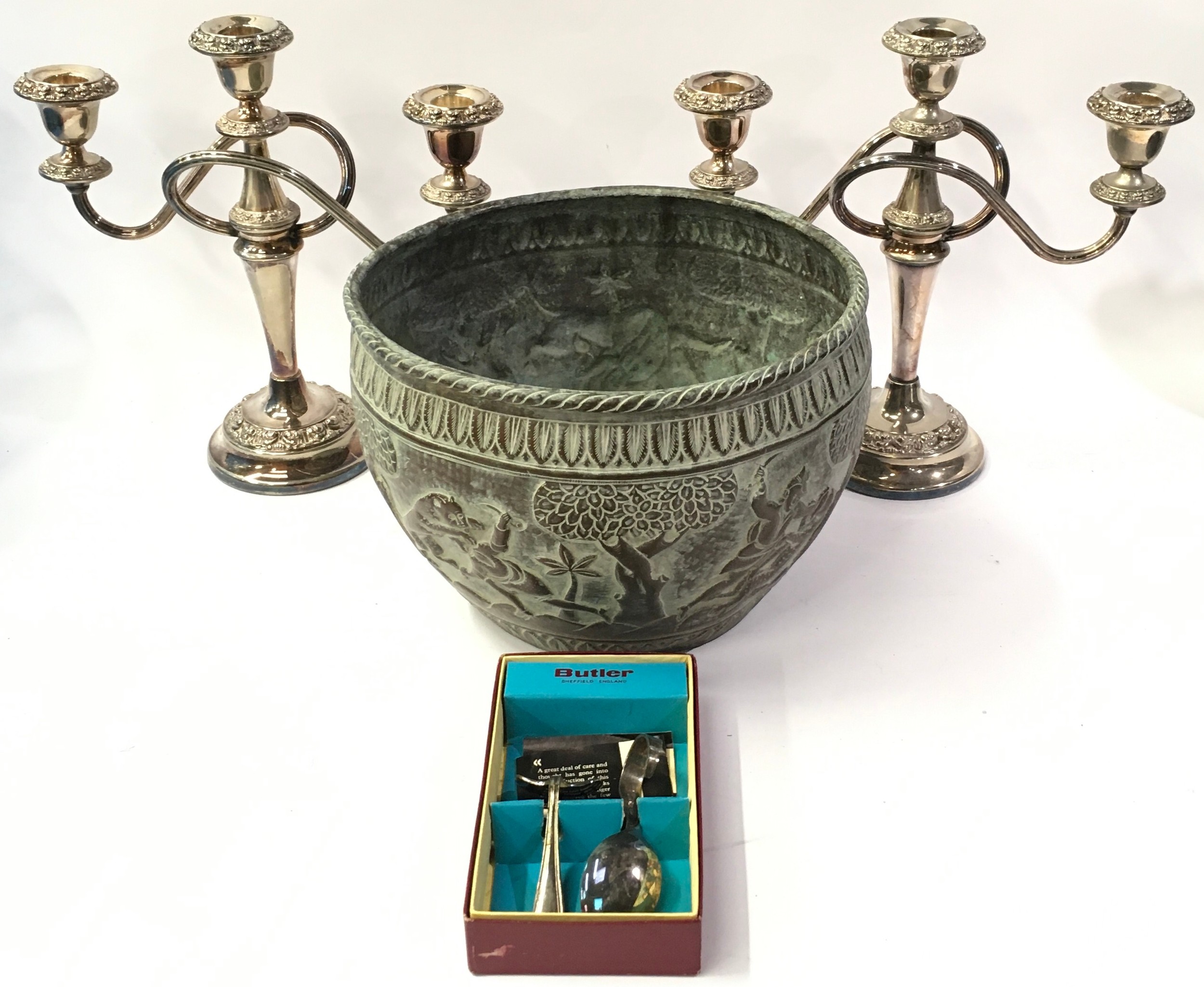 Copper planter with tribal decoration together with a pair of silver plated candelabras and a silver