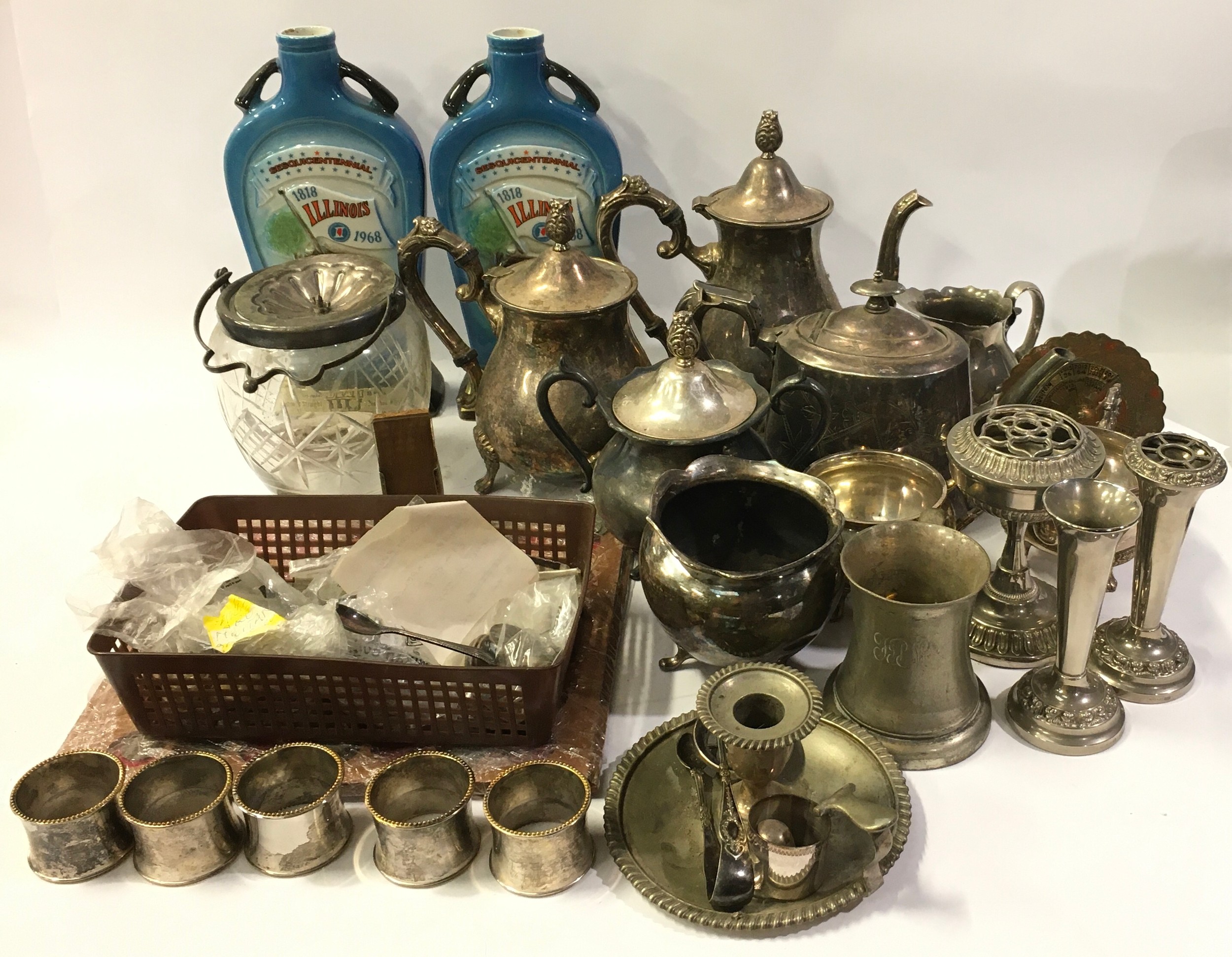 Large collection of silver plated items with some coins and two Illinois whisky bottles.