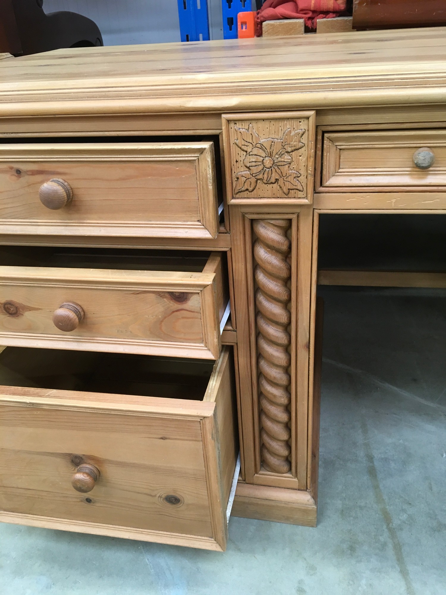 Solid pine desk with 3 side draws and a central draw turned up supports and carved motif - Image 6 of 8