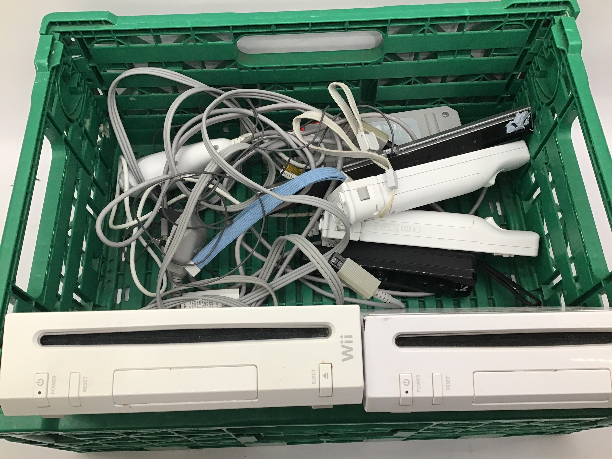 2 Wii units with controllers and leads.