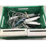 2 Wii units with controllers and leads.