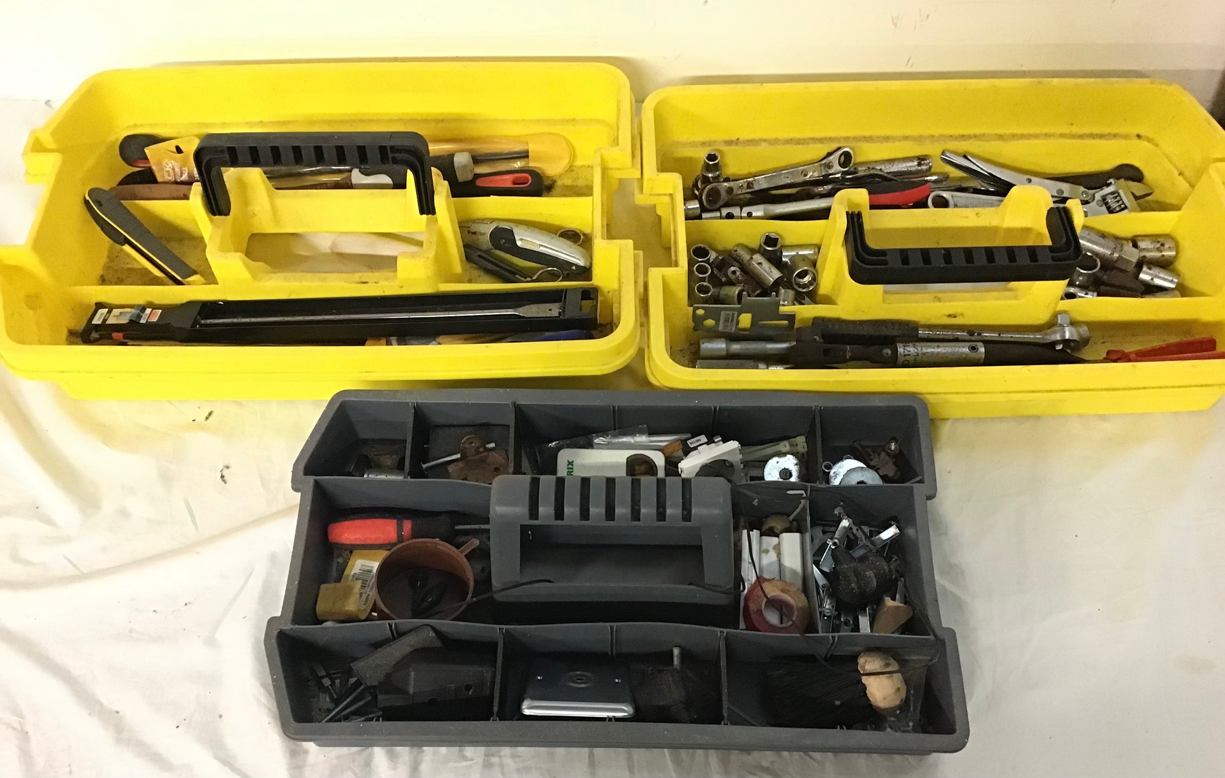 Various selection of tools spread over 2 large boxes.