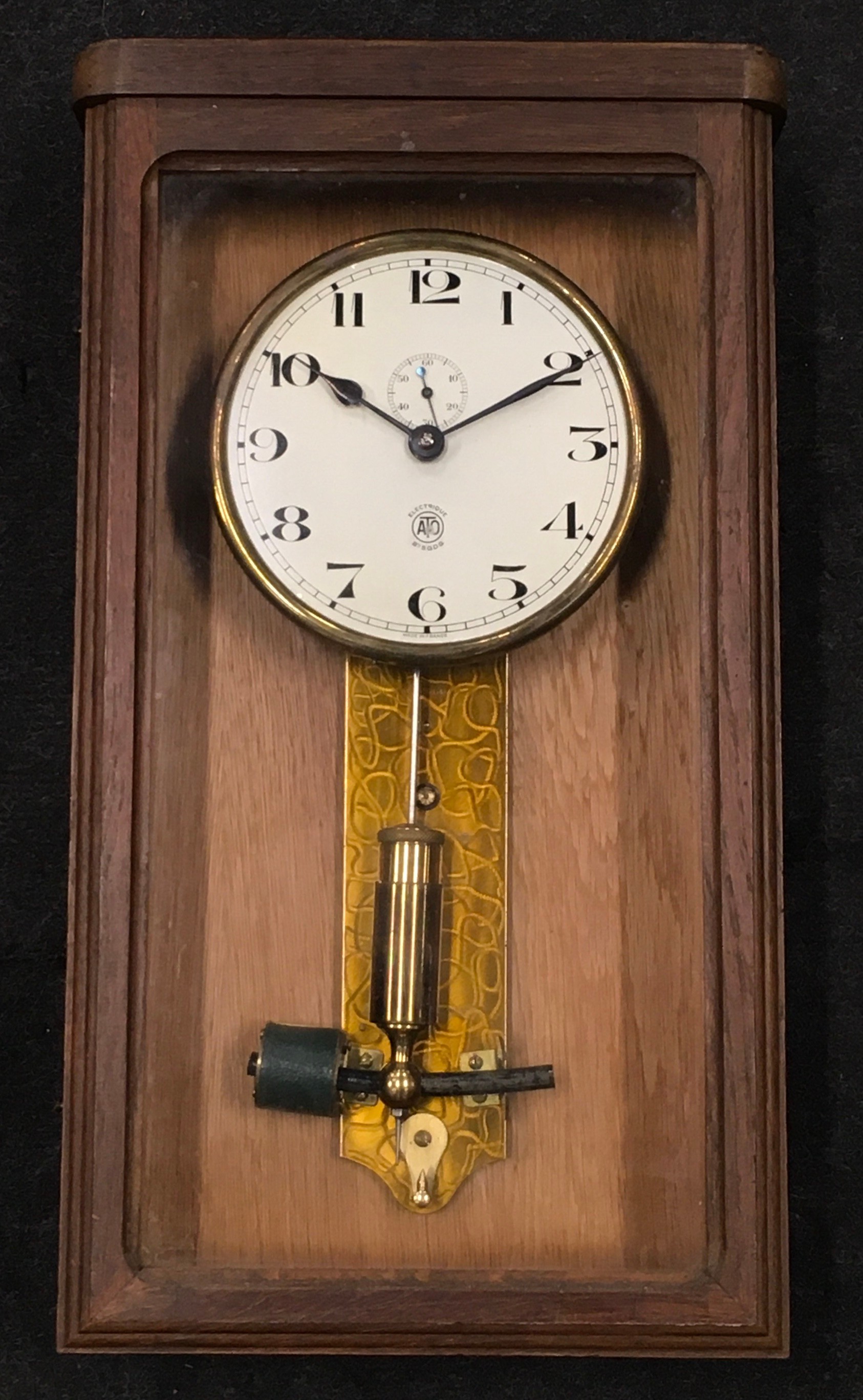 ATO Swiss made electronic oak cased wall clock 47x27x12cm.