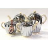 Four piece Heatmaster De Luxe silver plated and ceramic 20th century tea set.