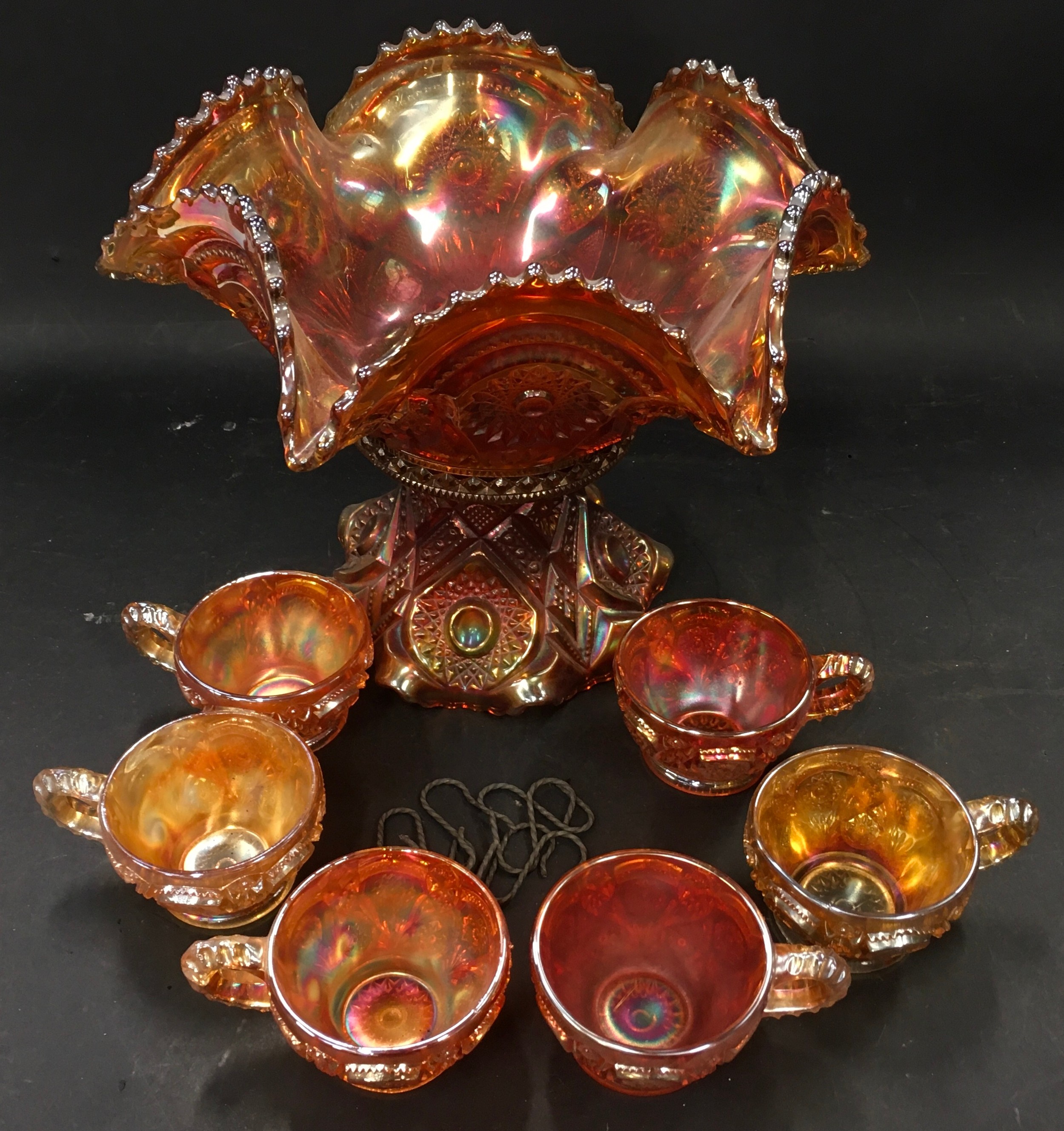 Vintage carnival glass punch bowl set with six glasses.