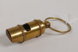 A brass RMS Titanic White Star Line reproduction ship's whistle, 4" long