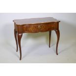 A C19th Dutch marquetry inlaid walnut single drawer side table, with shaped top and sides, raised on