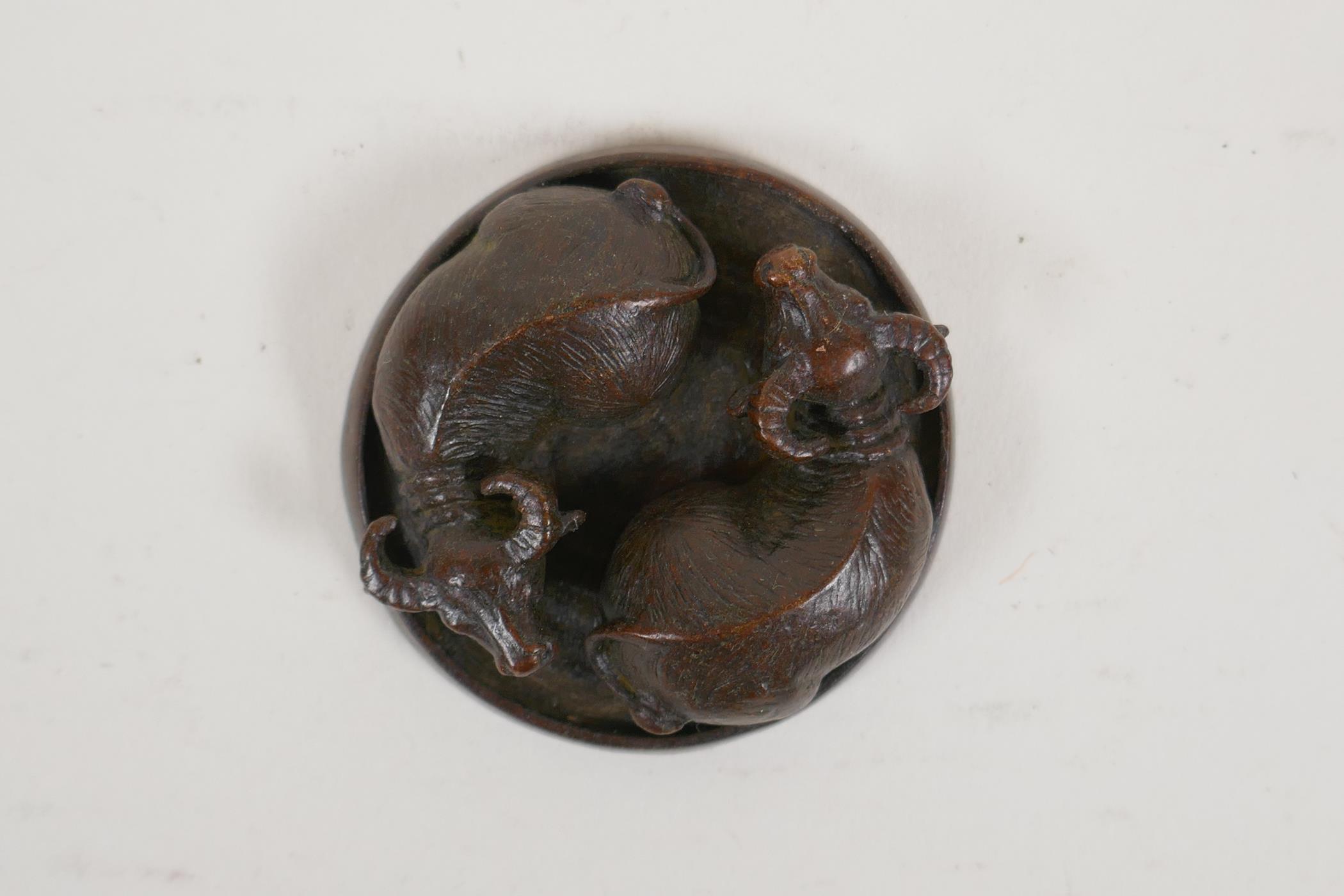 A Japanese bronze okimono in the form of two water buffalo, 2" drop - Image 2 of 3