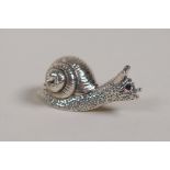 A miniature sterling silver box and cover in the form of a snail, 1" long